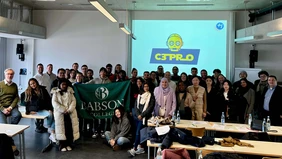 A group of students and their professors in a classroom