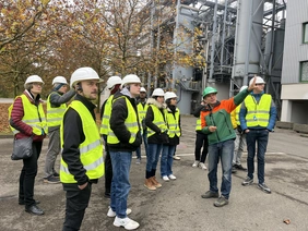 Students in front of the waste incineration plant