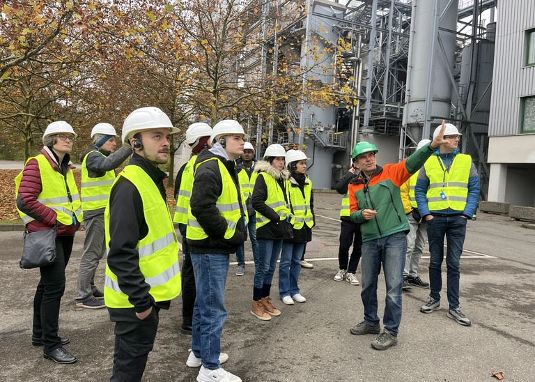 Students in front of the waste incineration plant