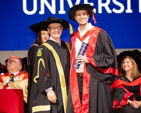 Presentation of the doctoral certificate to Dr. Michael Roth at RMIT in Melbourne