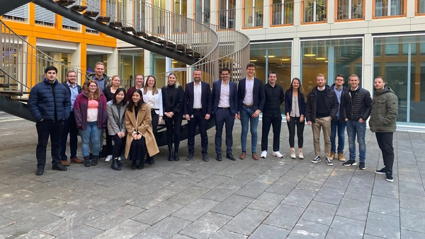 A group of people in front of a building